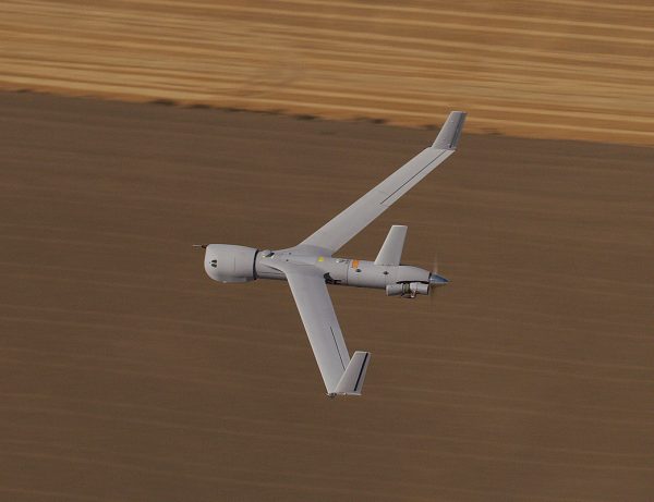 ScanEagle flying over field